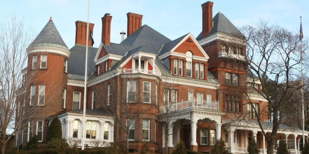 Grand staircases, state-shaped pools, and bowling alleys: Photos show every state governor’s mansion